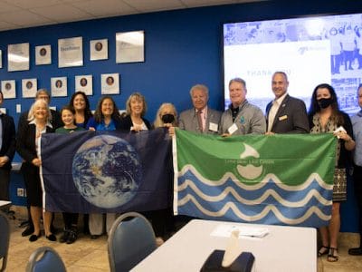 Antunes Receives SCARCE’s Earth and Water Flag